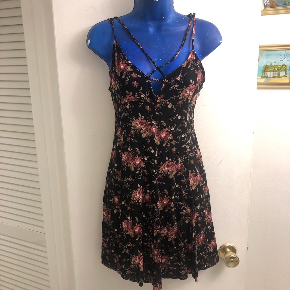 Black and pink floral mini dress with cross cross front and cut out back